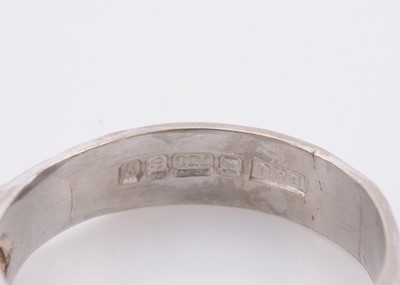 Lot 144 - A three stone diamond set 18ct white gold lady's dress ring