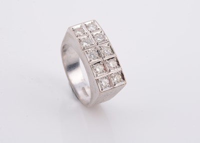 Lot 145 - An 18ct white gold diamond set tablet dress ring