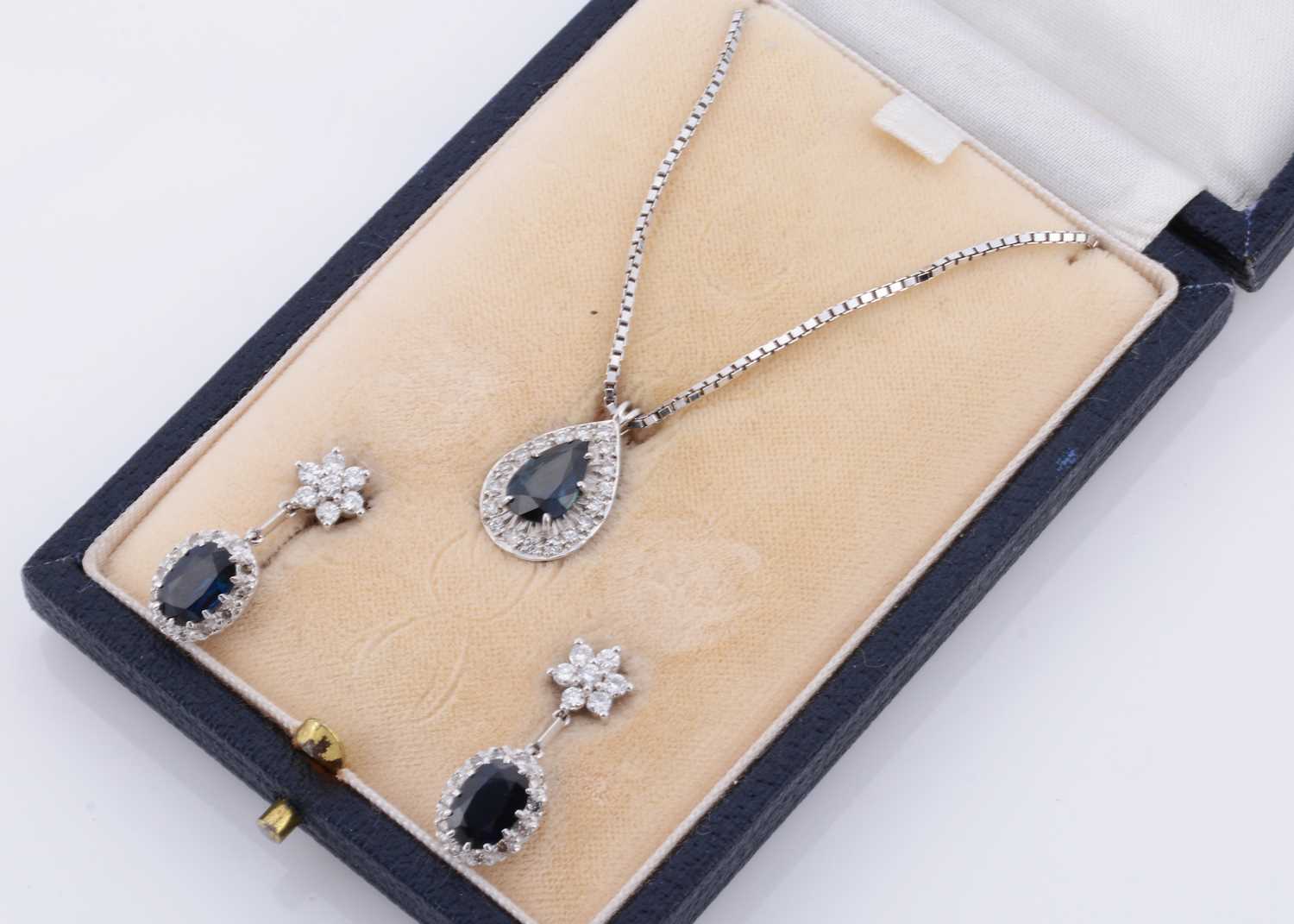 Lot 147 - A cased sapphire and diamond necklace and earring set
