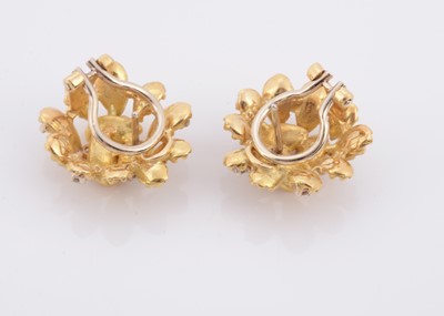 Lot 148 - A pair of diamond and 18ct (tested) clip earrings
