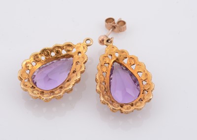 Lot 149 - A pair of pear shaped amethyst drop earrings
