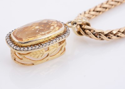 Lot 155 - A Citrine and diamond cluster pendant on a chevron link necklace