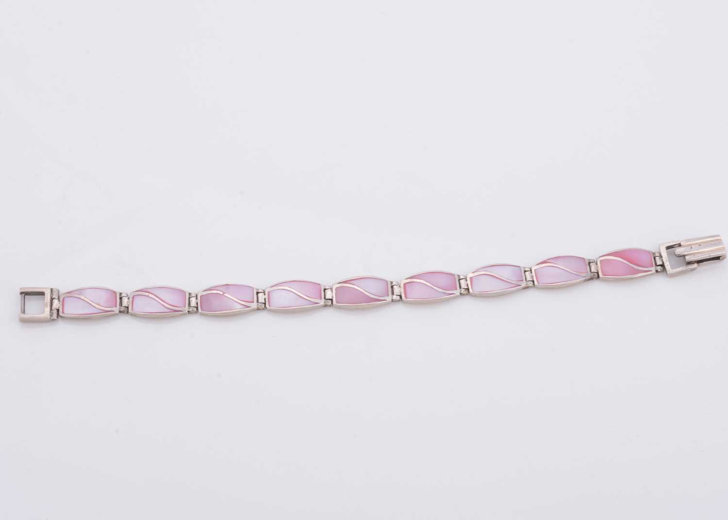 Lot 159 - A silver and pink stained mother of pearl line bracelet