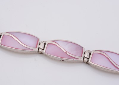 Lot 159 - A silver and pink stained mother of pearl line bracelet