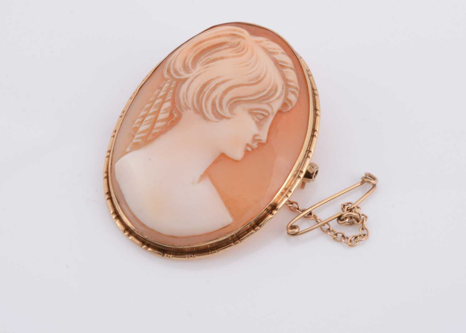 Lot 161 - A carved shell cameo brooch in  a 9ct gold frame