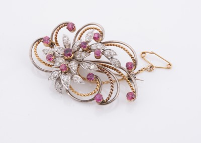 Lot 165 - A ruby and diamond two coloured gold floral spray brooch