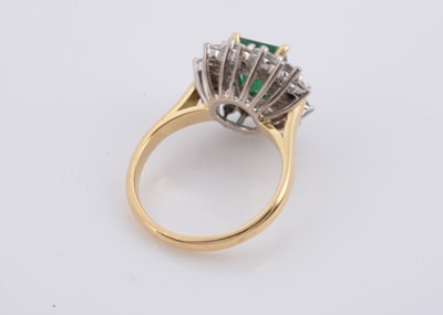 Lot 172 - An 18ct gold two colour emerald and diamond cluster ring