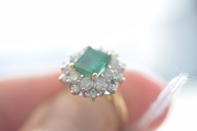 Lot 172 - An 18ct gold two colour emerald and diamond cluster ring