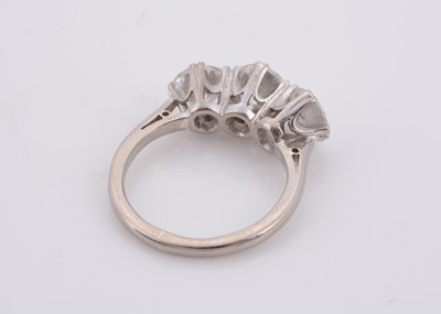 Lot 175 - An 18ct gold three stone diamond dress ring
