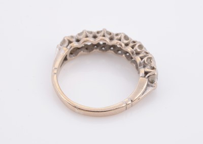 Lot 176 - An 18ct gold diamond half hoop eternity ring