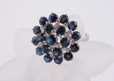 Lot 177 - An 18ct white gold sapphire and diamond dress ring