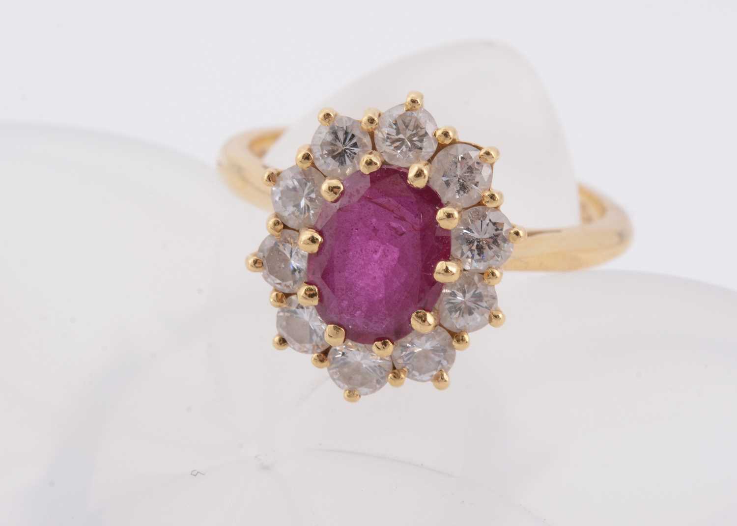 Lot 179 - An 18ct gold ruby and diamond cluster ring