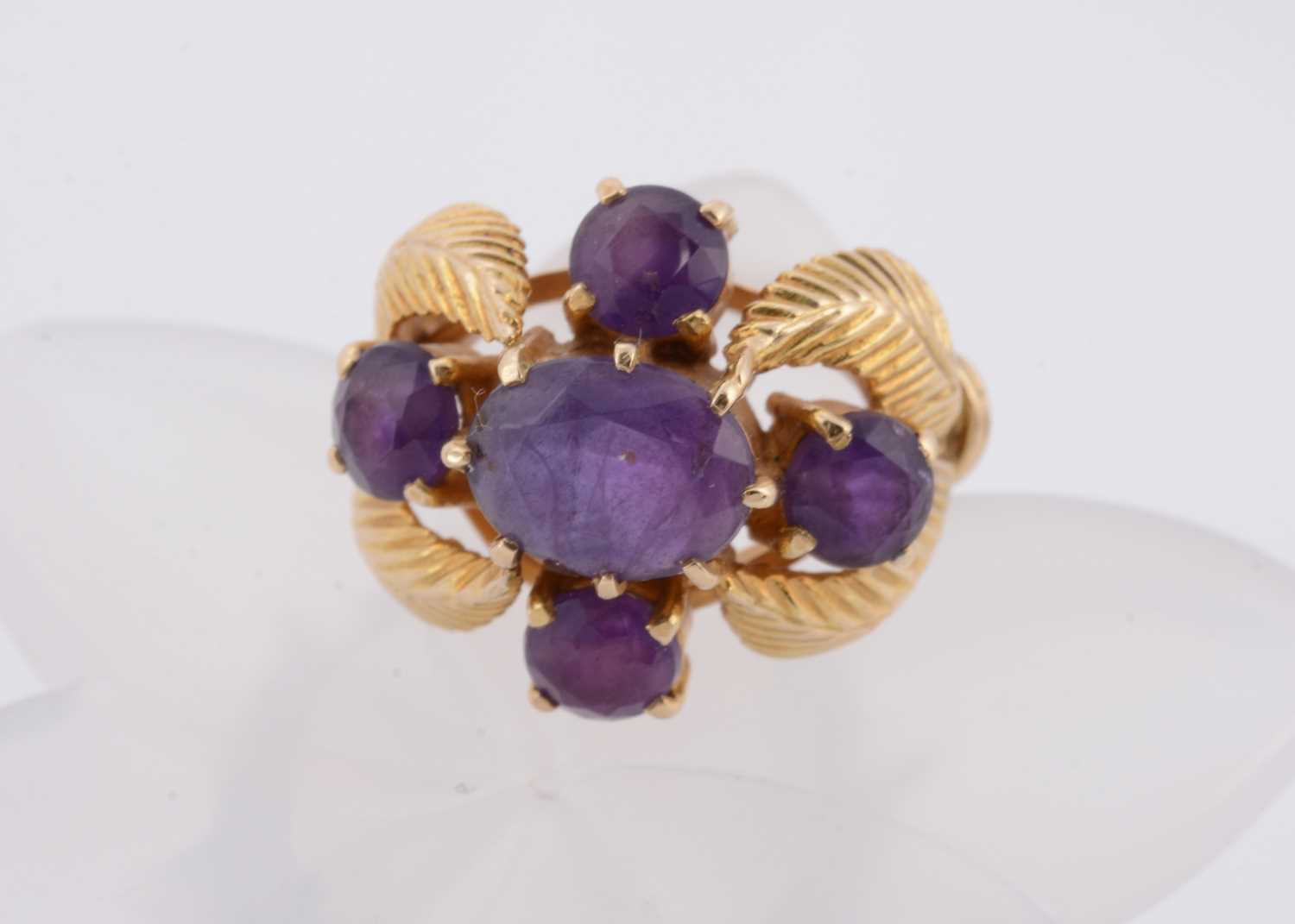 Lot 181 - A 9ct gold amethyst cruciform and feather worked dress ring