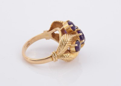 Lot 181 - A 9ct gold amethyst cruciform and feather worked dress ring