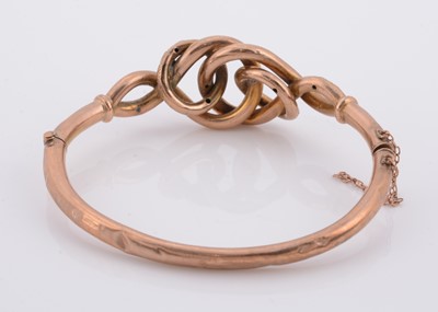 Lot 185 - A Victorian yellow metal hollow knot bangle