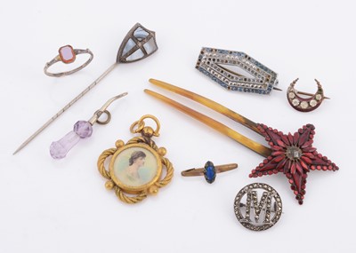Lot 191 - A Scottish hardstone shield shaped stick pin