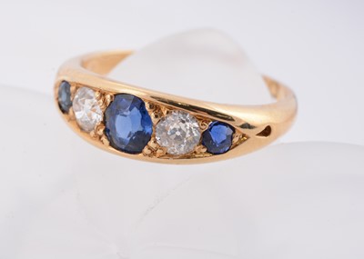 Lot 194 - An Edwardian 18ct gold sapphire and diamond dress ring