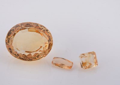 Lot 212 - A large Citrine oval mixed cut loose stone