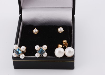 Lot 232 - A pair of topaz and pearl silver set ear studs