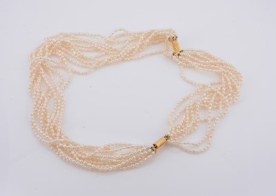 Lot 240 - A freshwater multi strand pearl necklace and bracelet