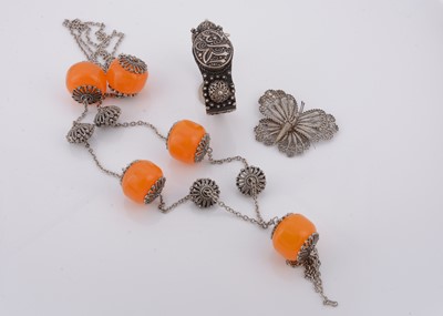 Lot 244 - A North African white metal bangle