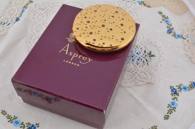 Lot 339 - A contemporary gilt metal Asprey circular compact