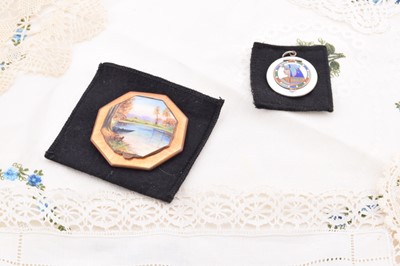 Lot 351 - A German octagonal orange guilloche enamel and hand painted lake scene decorated compact