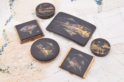Lot 363 - A collection of Art Deco and later Japanese damascene decorated compacts