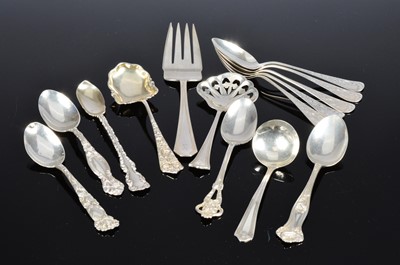 Lot 371 - A collection of American spoons and a fish fork