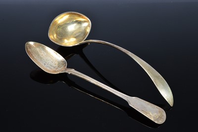 Lot 386 - A Victorian silver fiddle pattern basting spoon by Richard Crossley together with a soup ladle