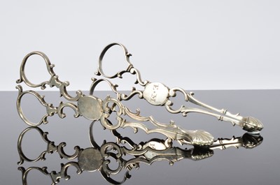 Lot 401 - Two pairs of George III sugar scissors