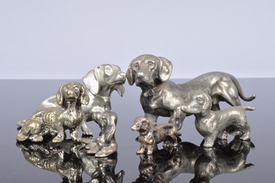 Lot 406 - Two miniature silver models of dogs and four further small dogs