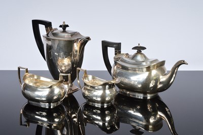 Lot 438 - A George V and later associated four piece silver tea set