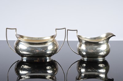 Lot 438 - A George V and later associated four piece silver tea set
