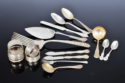 Lot 448 - A collection of British and American silver and Sterling marked flatware and napkin rings