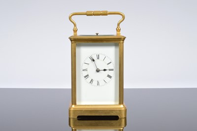 Lot 503 - A vintage brass carriage repeater timepiece