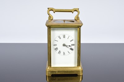 Lot 504 - A vintage brass carriage repeater timepiece