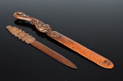 Lot 562 - Two carved wooden letter openers