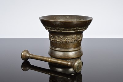Lot 569 - An antique bronze pestle and mortar