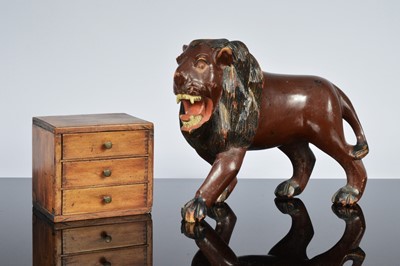 Lot 582 - A vintage carved wooden figure of a lion and a small apprentice style chest of drawers