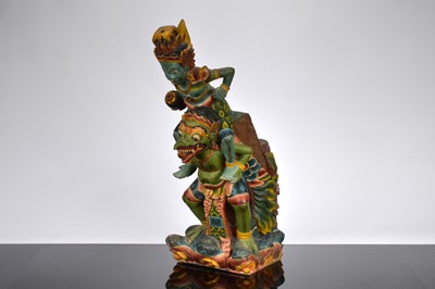 Lot 606 - A wooden carved Indonesian statue of Vishnu and Garuda