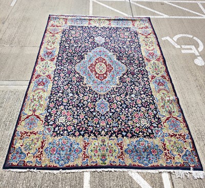 Lot 698 - A large 20th century Middle Eastern woollen and cotton carpet