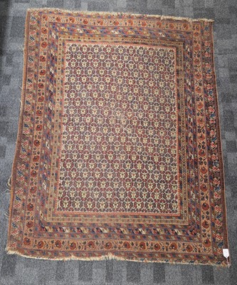 Lot 700 - A vintage Middle Eastern woollen carpet