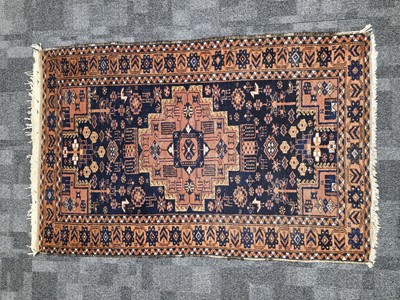 Lot 713 - An early 20th century Middle Eastern woollen carpet