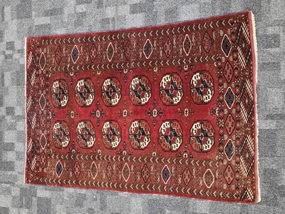 Lot 716 - A vintage Turkman Tekke woollen carpet