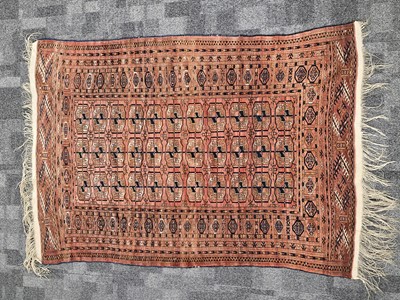 Lot 717 - A vintage Turkman Tekke woollen carpet