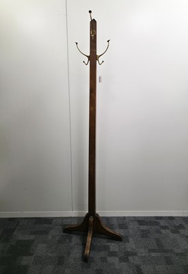 Lot 720 - An Arts & Crafts period oak coast stand