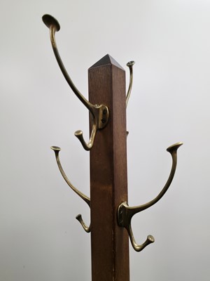 Lot 720 - An Arts & Crafts period oak coast stand