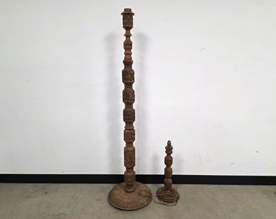 Lot 725 - Two Indian carved wooden lamp bases