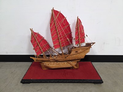 Lot 727 - A wooden model of a junk in display cabinet
